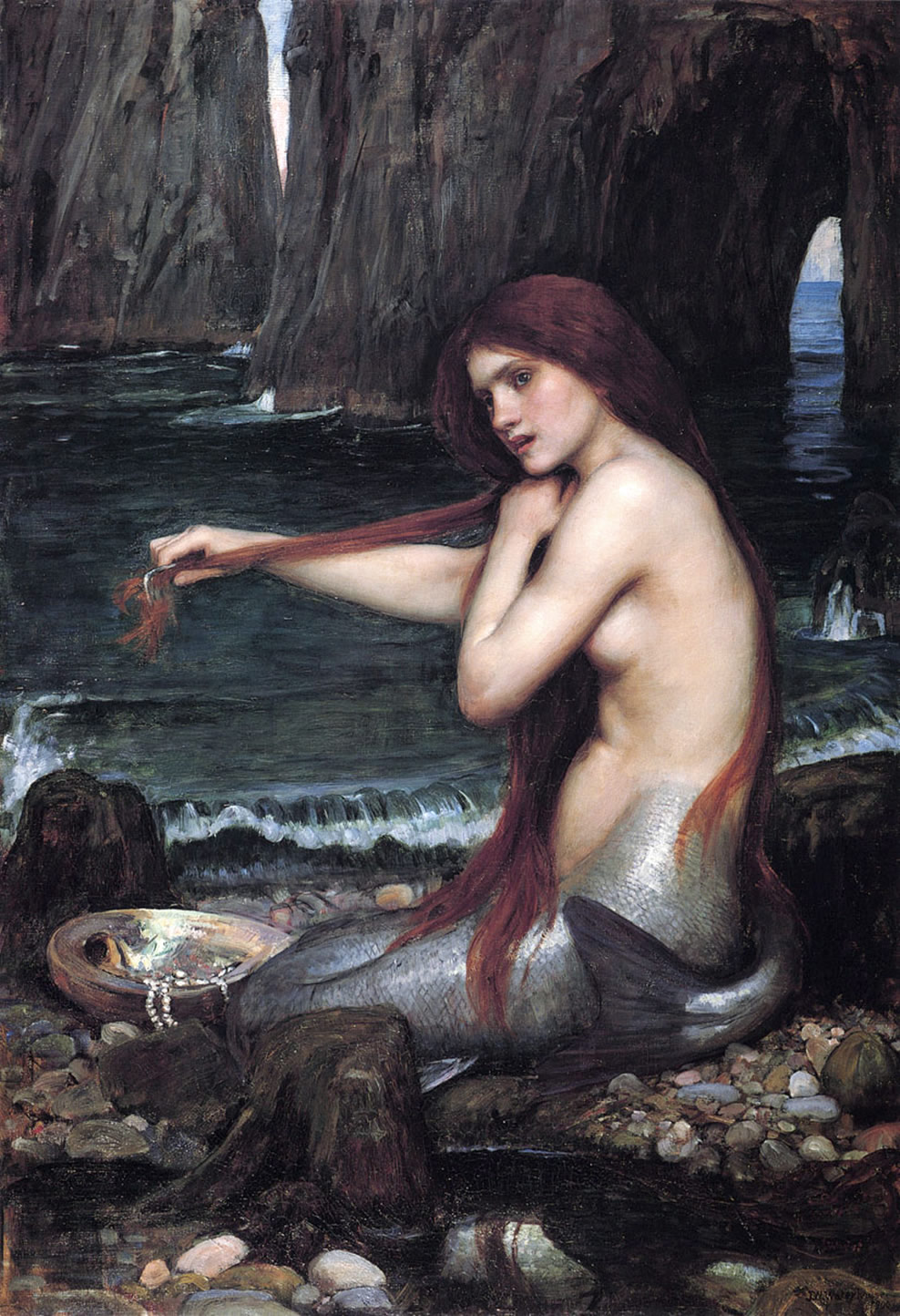 Auf dem Bild sist eine Meerjungfrau. Sie sitzt an einem Steinstrand. Sie kämt sich die Haare.